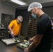 Sailors aboard the USS John Finn volunteer at Willing Hearts in Changi, Singapore