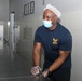 Sailors aboard the USS John Finn volunteer at Willing Hearts in Changi, Singapore