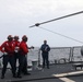 Sailors aboard the USS John Finn conduct a crash and salvage drill in the Indian Ocean