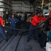 Sailors aboard the USS John Finn conduct a crash and salvage drill in the Indian Ocean
