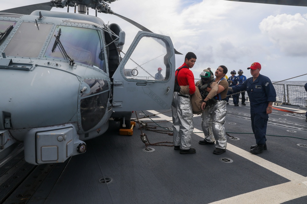 Sailors aboard the USS John Finn conduct a crash and salvage drill in the Indian Ocean