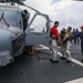 Sailors aboard the USS John Finn conduct a crash and salvage drill in the Indian Ocean