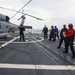 Sailors aboard the USS John Finn conduct a crash and salvage drill in the Indian Ocean