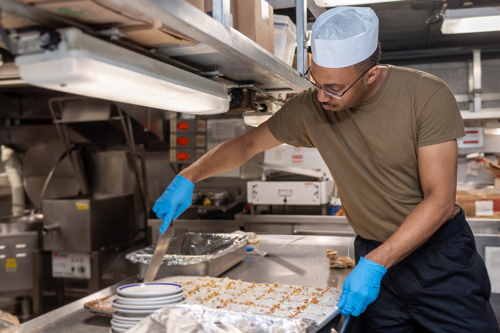 USS PEARL HARBOR (LSD 52) Sailors prepare lunch in the galley