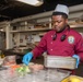 USS PEARL HARBOR (LSD 52) Sailors prepare lunch in the galley