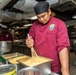 USS PEARL HARBOR (LSD 52) Sailors prepare lunch in the galley