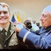 Lt. Col. (Ret.) Stephen Harmon adjusts 2nd Lt. Christopher Harmon’s rank after his commissioning ceremony.