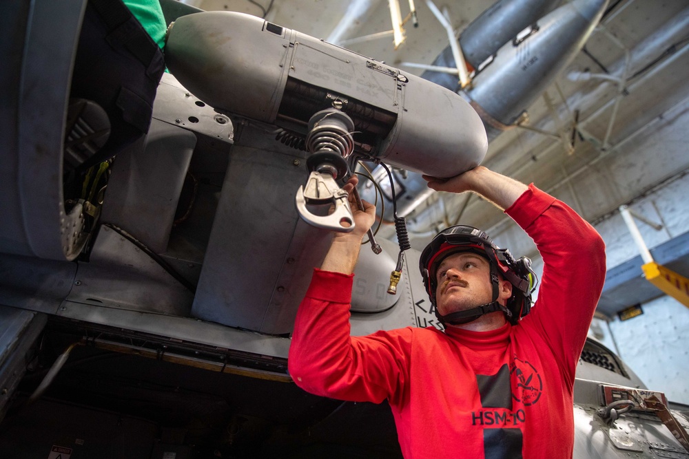 Helicopter Maritime Strike Squadron 70 Sailor Conducts Maintenance