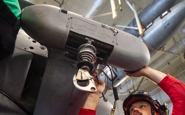 Helicopter Maritime Strike Squadron 70 Sailor Conducts Maintenance