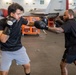 USS Gerald R. Ford (CVN 78) Sailors Spar in the Hangar Bay