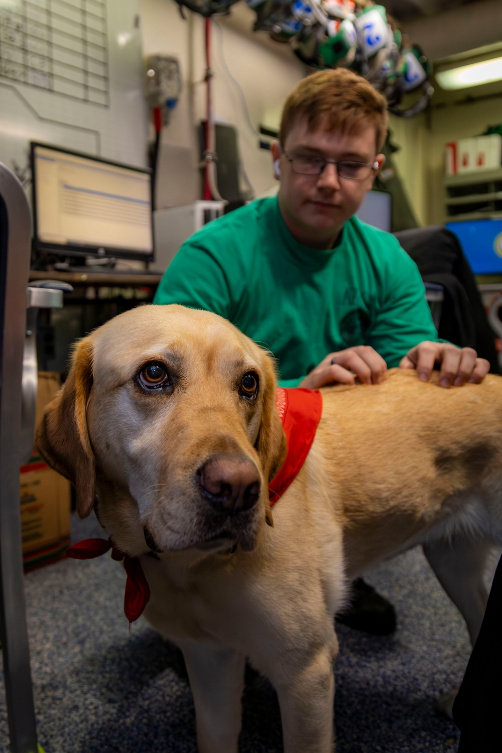 USS Gerald R. Ford (CVN 78) Expeditionary Facility Working Dog Greets Sailors