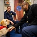 USS Gerald R. Ford (CVN 78) Expeditionary Facility Working Dog Greets Sailors