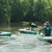 Competitors paddle kayak in River Operations - 2025 National Best Warrior