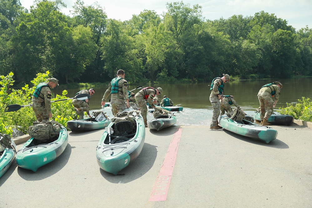Competitors embark in kayak in river operations - 2025 National Best Warrior