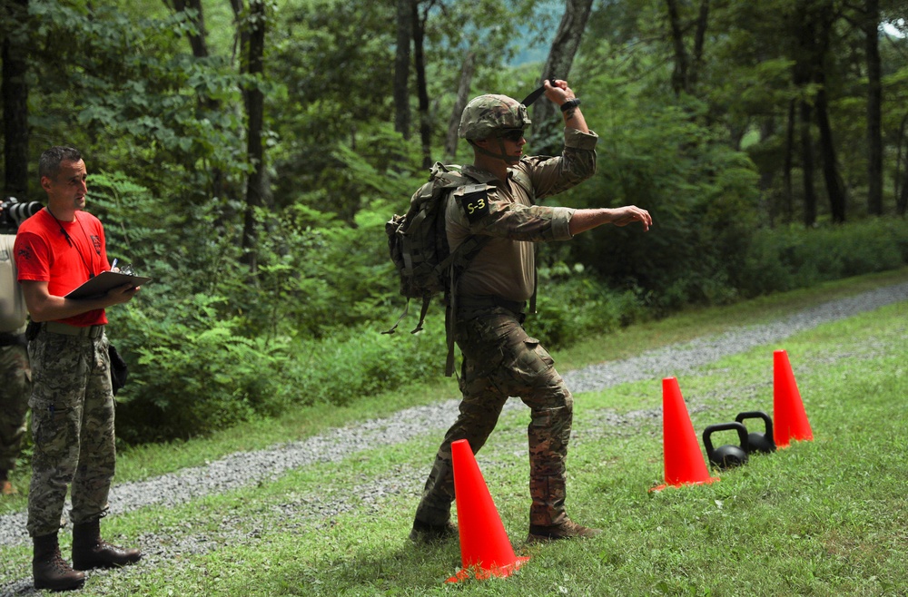 Spc. Jaden Hughes throws a knife - 2025 National Best Warrior
