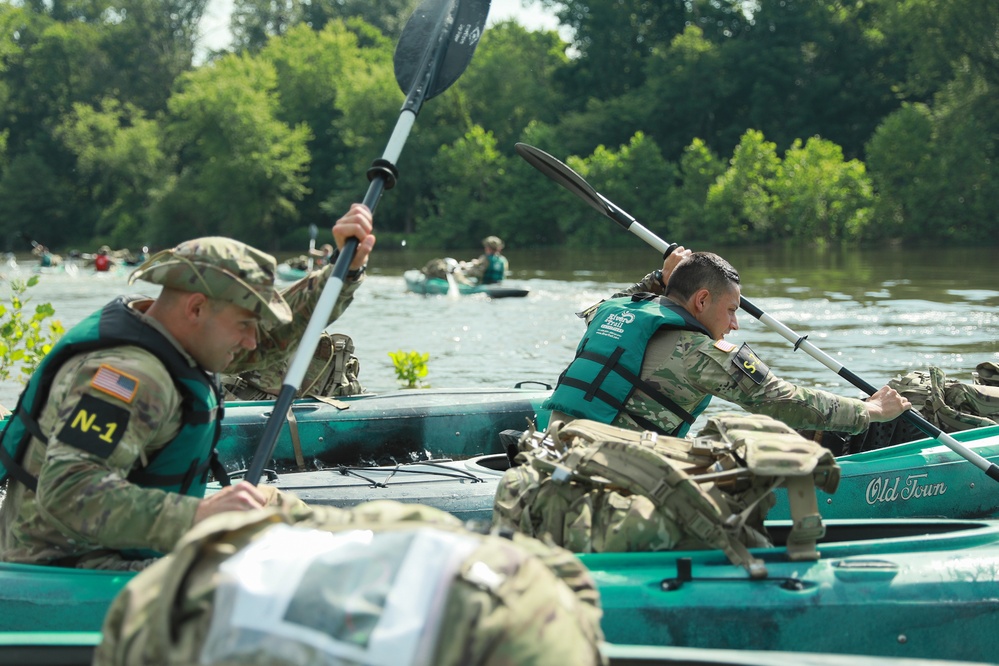 Competitors embark in kayak on river operations - 2025 National Best Warrior