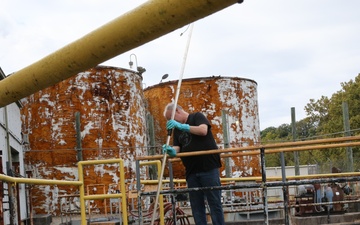 Radford Army Ammunition Plant Bioplant employee checking clarifiers, the last line of water treatment for wastewater.