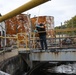 Radford Army Ammunition Plant Bioplant employee checking clarifiers, the last line of water treatment for wastewater.