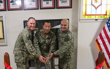 NSCS CO CAPT T. Richie Jenkins (left), RADM Ken Epps (center) and ENS Joseph Montano (right) cut the commissioning ribbon