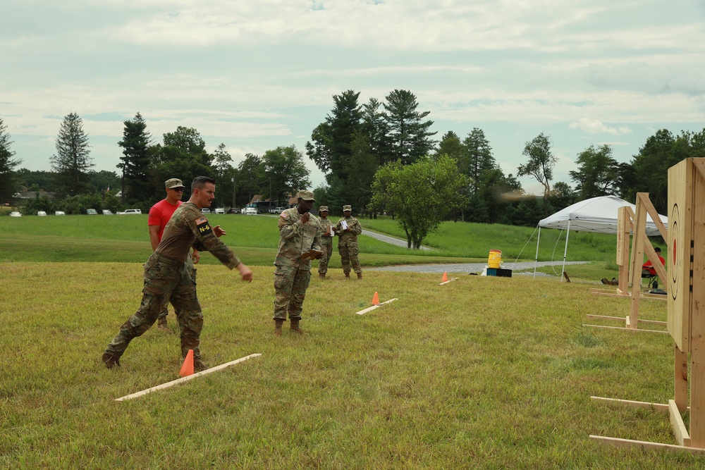 Sgt. Matthew Lee throws an axe - 2025 National Guard Best Warrior Competition