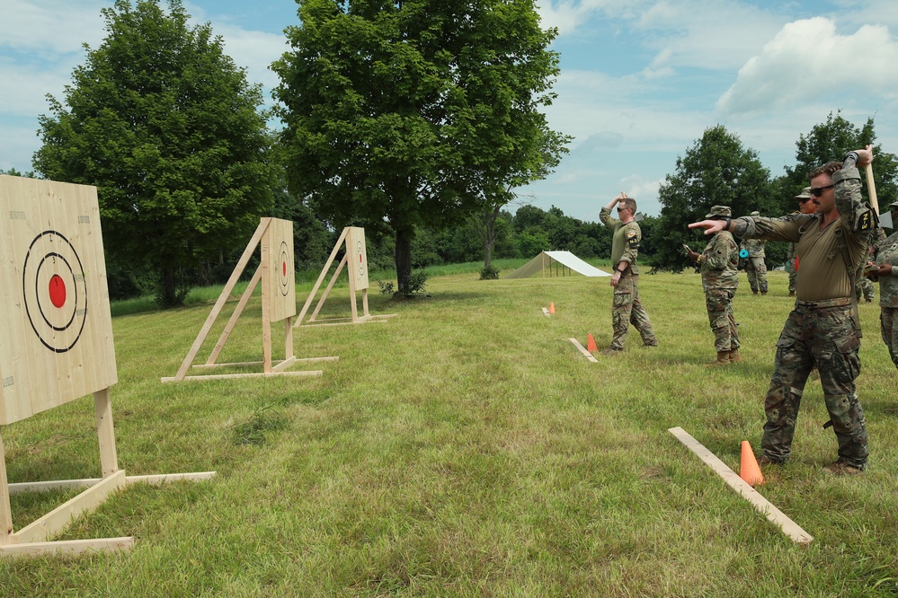 Sgt. Miles Crawford and Staff Sgt. Nicolas White throw axes - 2025 National Best Warrior