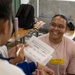 Sailors share in language exchange with Okinawan school children