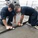 Curtis Wilbur Sailors Conduct Weapons Maintenance