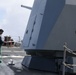 Sailors aboard the USS John Finn conduct a freshwater wash down in the Indian Ocean