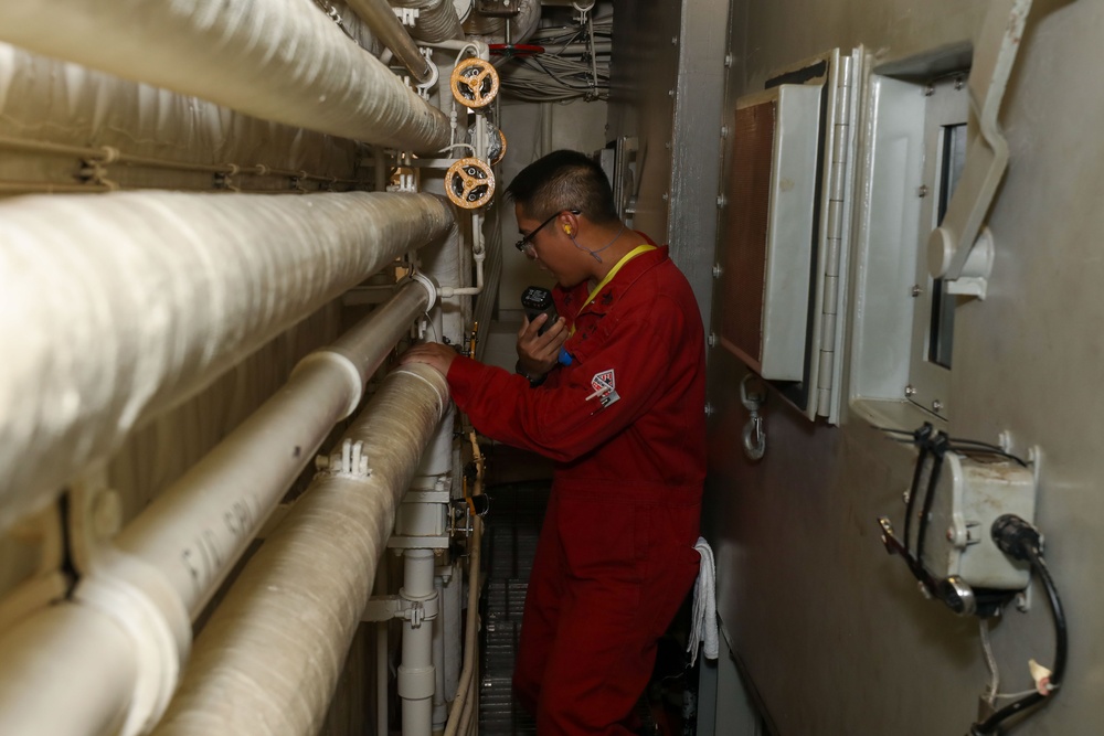 Sailors aboard the USS John Finn conduct an engineering training team drill in the Indian Ocean