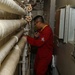 Sailors aboard the USS John Finn conduct an engineering training team drill in the Indian Ocean