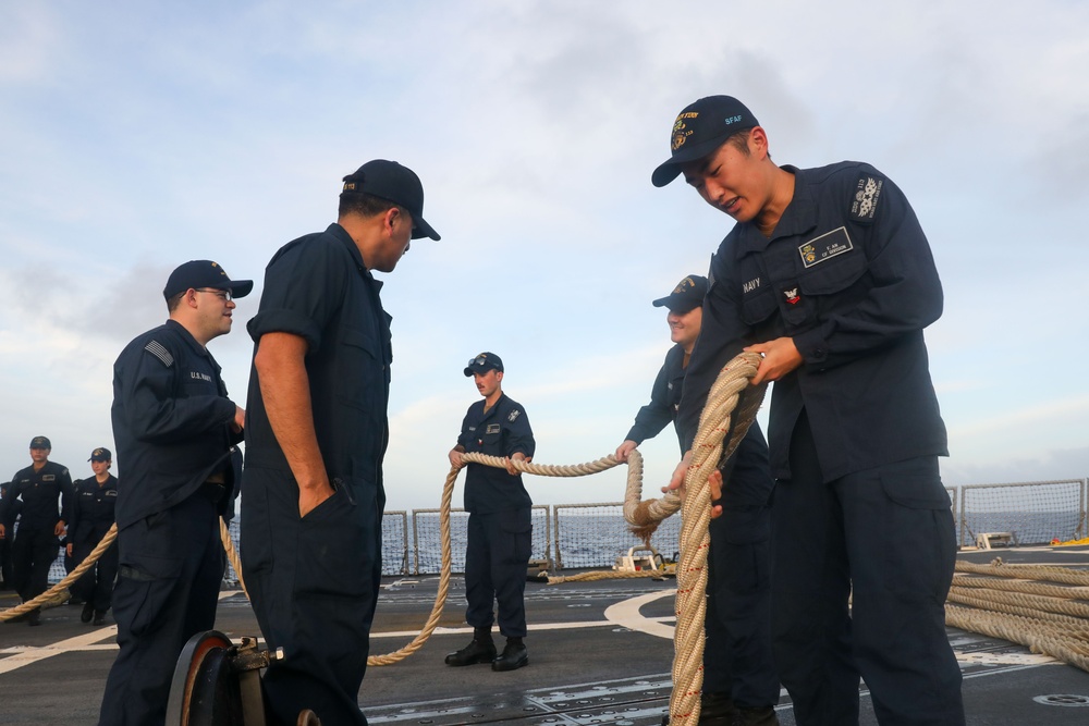 Sailors aboard the USS John Finn conduct a sea and anchor detail in Diego Garcia