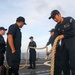 Sailors aboard the USS John Finn conduct a sea and anchor detail in Diego Garcia