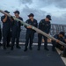 Sailors aboard the USS John Finn conduct a sea and anchor detail in Diego Garcia