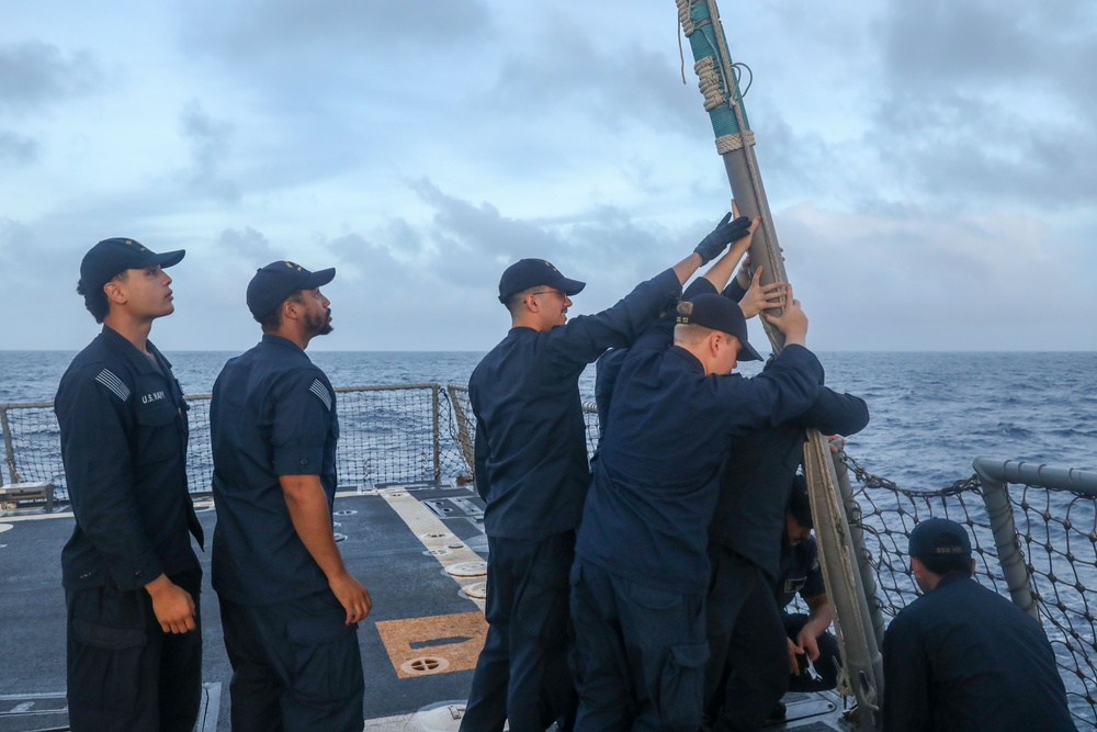 Sailors aboard the USS John Finn conduct a sea and anchor detail in Diego Garcia