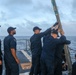 Sailors aboard the USS John Finn conduct a sea and anchor detail in Diego Garcia