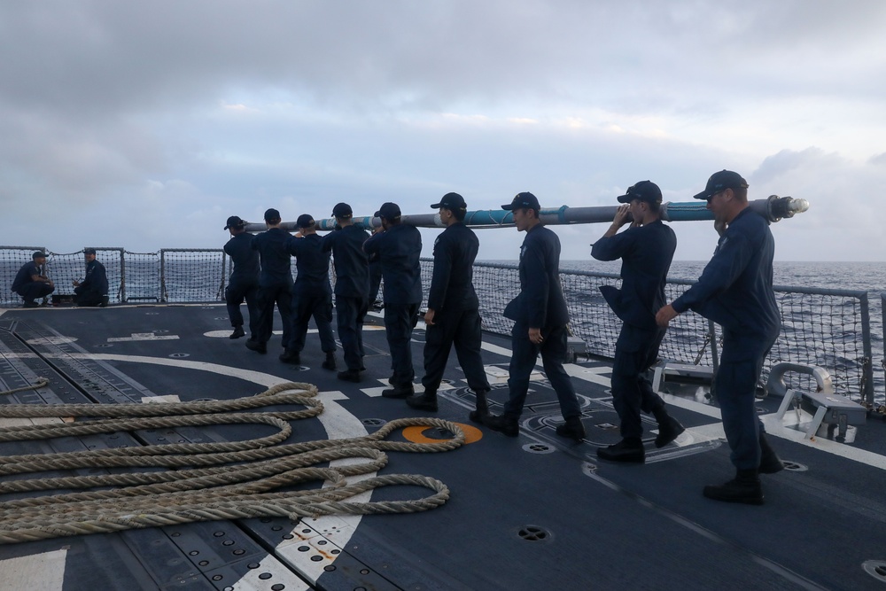 Sailors aboard the USS John Finn conduct a sea and anchor detail in Diego Garcia