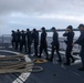 Sailors aboard the USS John Finn conduct a sea and anchor detail in Diego Garcia