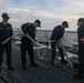 Sailors aboard the USS John Finn conduct a sea and anchor detail in Diego Garcia