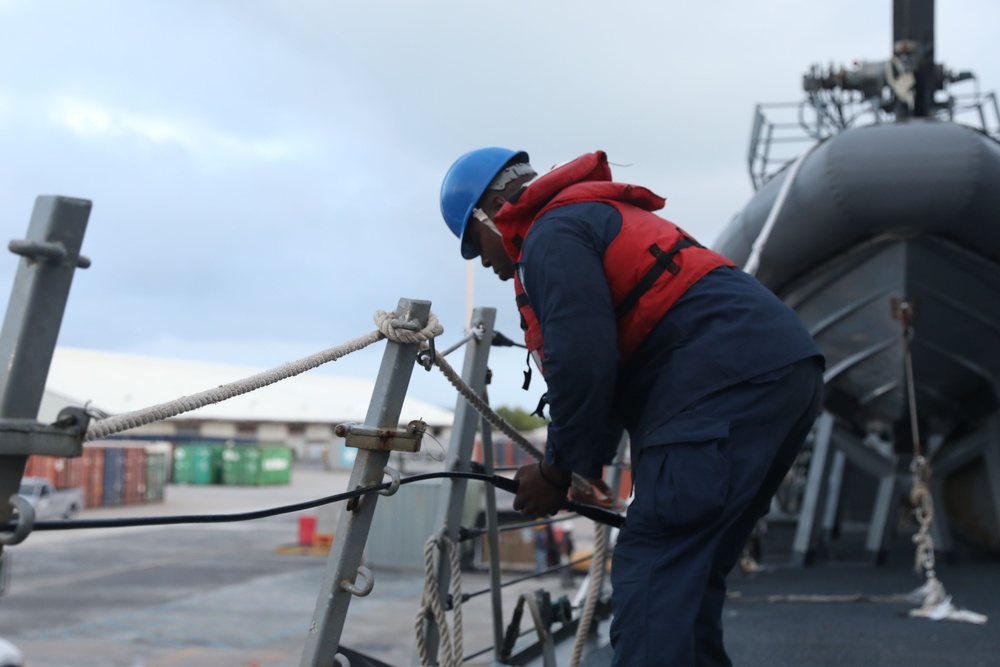 Sailors aboard the USS John Finn conduct a sea and anchor detail in Diego Garcia