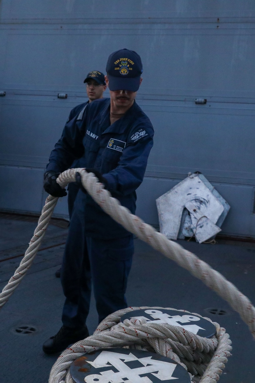 Sailors aboard the USS John Finn conduct a sea and anchor detail in Diego Garcia