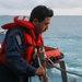 Sailors aboard the USS John Finn conduct a sea and anchor detail in Diego Garcia