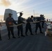 Sailors aboard the USS John Finn conduct a sea and anchor detail in Diego Garcia