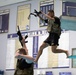 Spc. Robert Ruiz-Rhoades jumps off a diving board - 2025 National Best Warrior