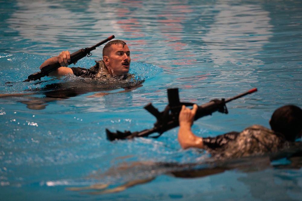 Sgt. Matthew Lee swims participates in a combat water survival test - 2025 National Best Warrior