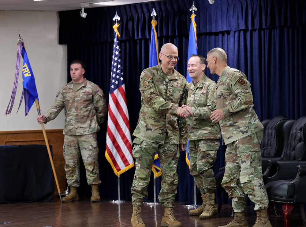 Outgoing 82nd Mission Support Group Commander Col. John Hollister shakes hands