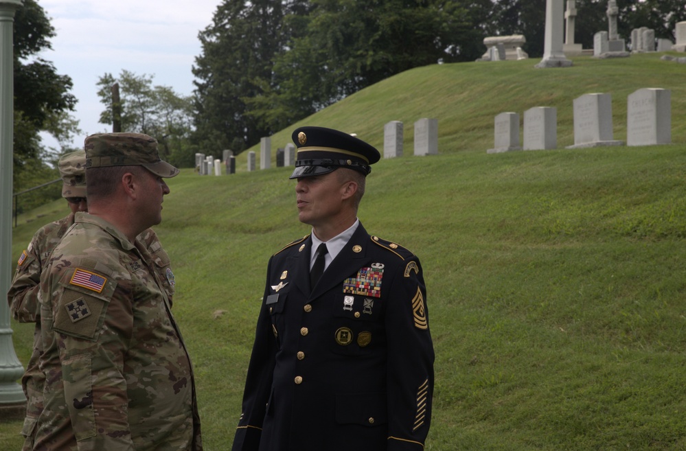 Sgt. Maj. James Fleming greets retired 1st Sgt. Brian Paape - 2025 National Best Warrior