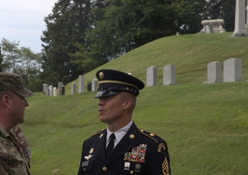 Sgt. Maj. James Fleming greets retired 1st Sgt. Brian Paape - 2025 National Best Warrior