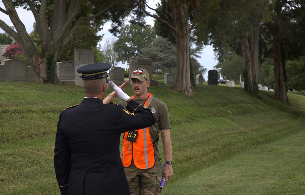 Sgt. Luke Cloward salutes retired 1st Sgt. Brian Paape - 2025 National Best Warrior