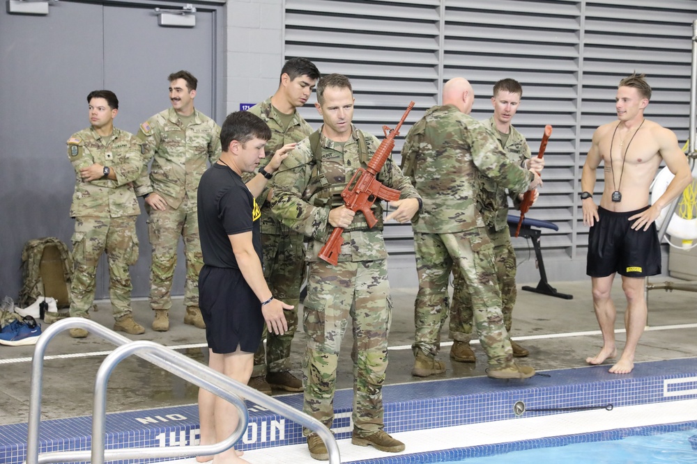 Infantry dives into water survival training