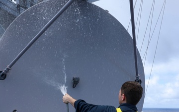 USS Bainbridge (DDG 96) Sailor Conducts Freshwater Washdown